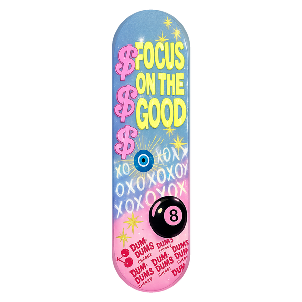 Focus On The Good wall skate deck by SeventySeven.DC — yellow type on a blue-to-pink fade with evil eye and eight ball